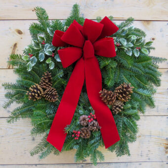 winnipesaukee wreath on natural wood background
