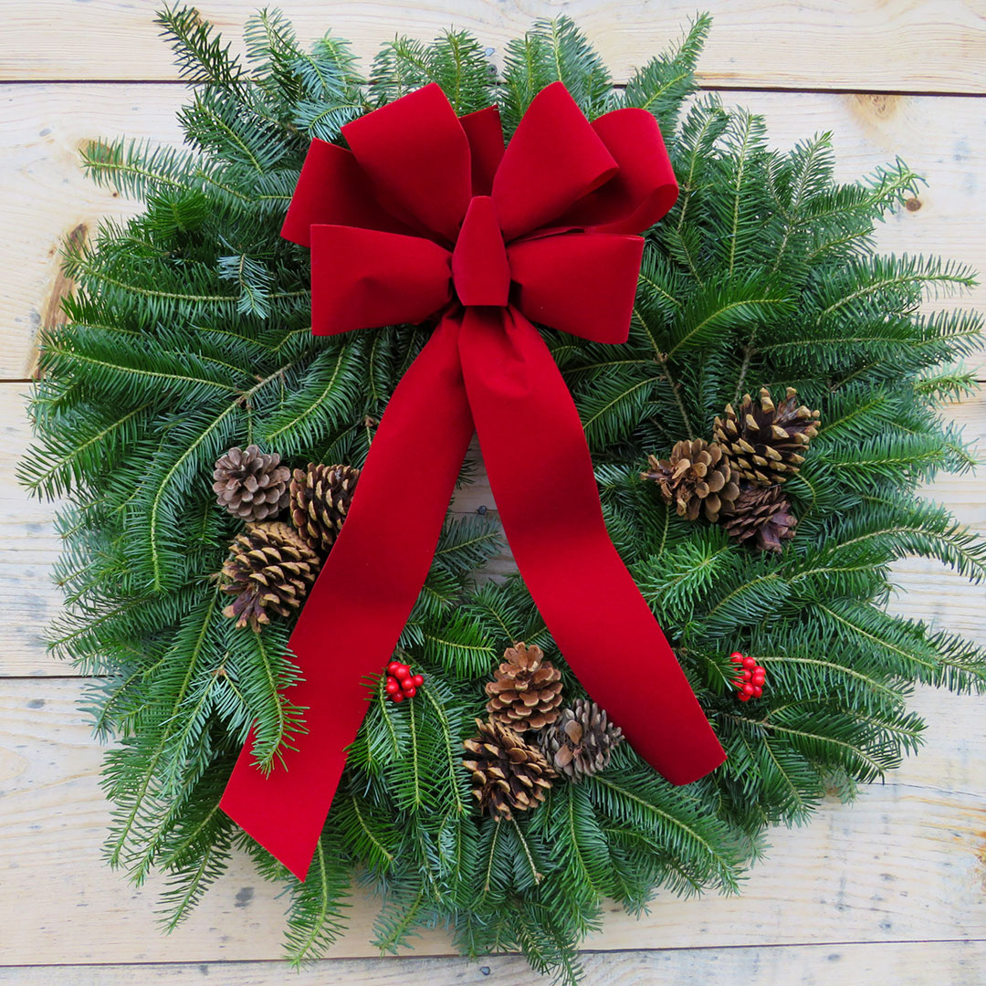 22 inch traditional wreath on natural wood background