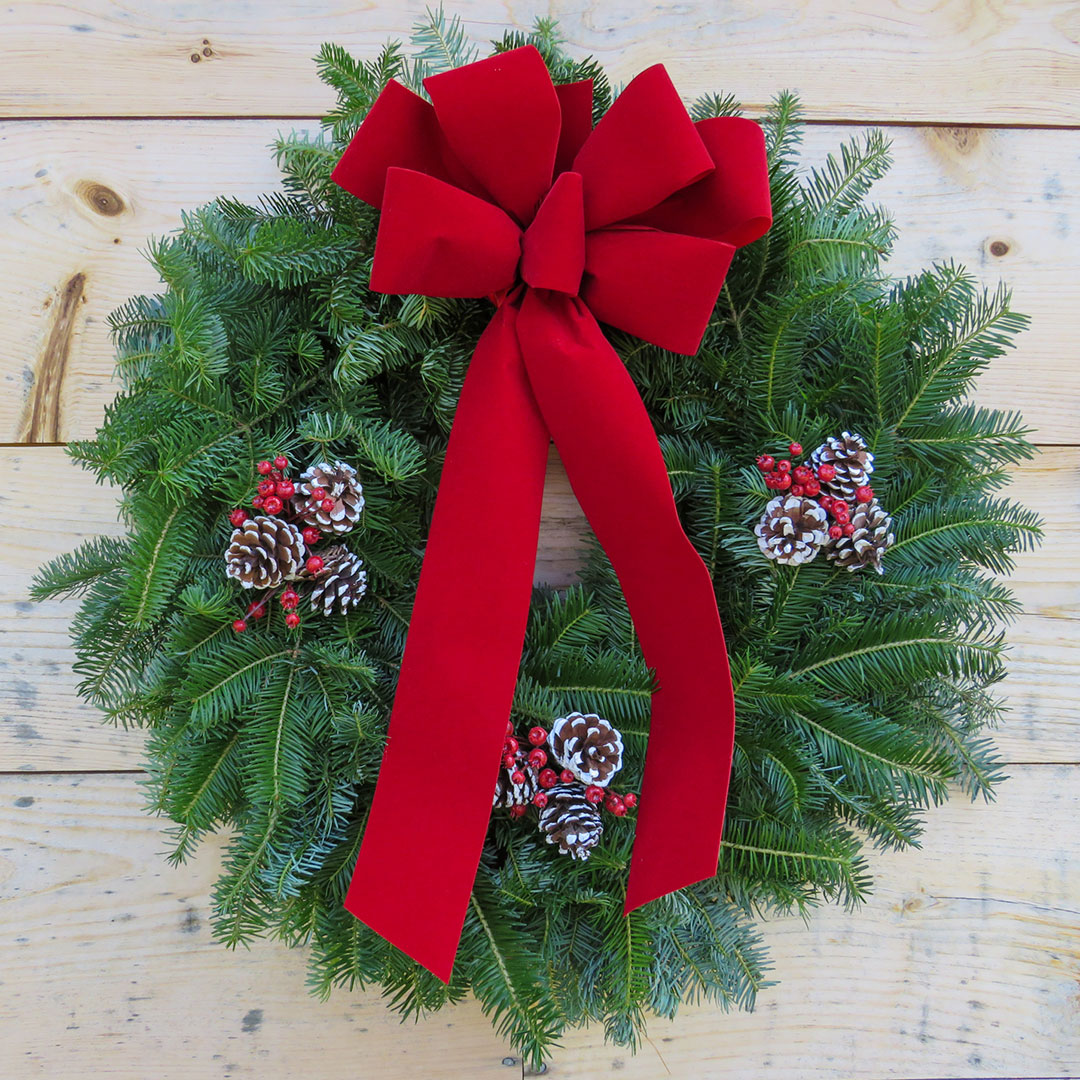 clearwater wreath on natural wood background